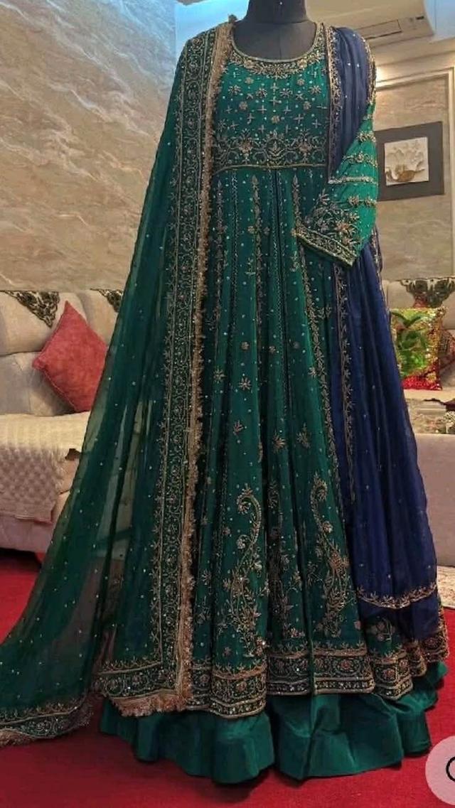 emerald green heavily embroidered silk anarkali gown