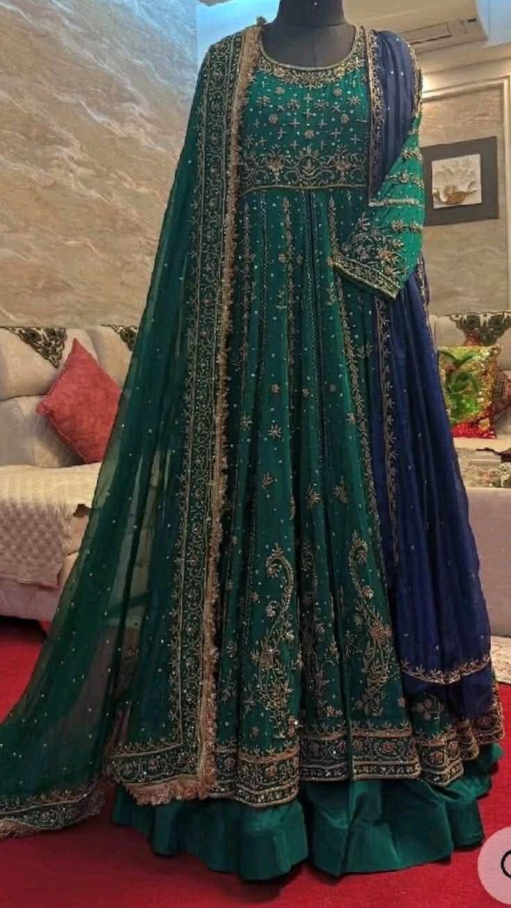 emerald green heavily embroidered silk anarkali gown