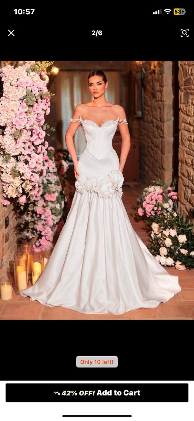 white corset bodice floor length gown with floral applique