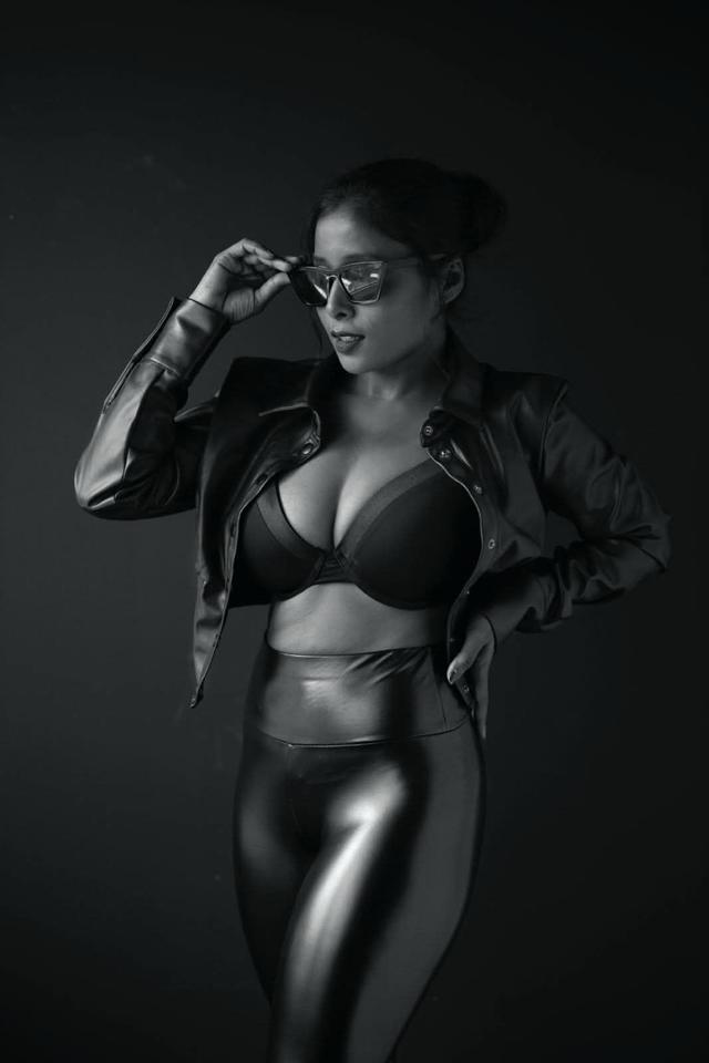 black faux leather jacket with matching high-waisted leggings