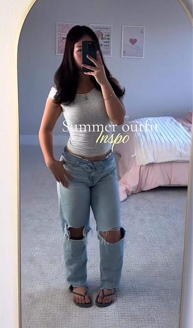light wash distressed crossover waist denim jeans