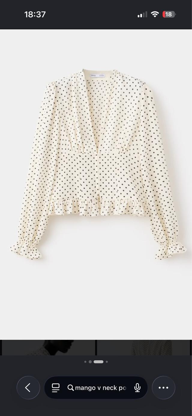 polka dot v-neck blouse with ruffled hem