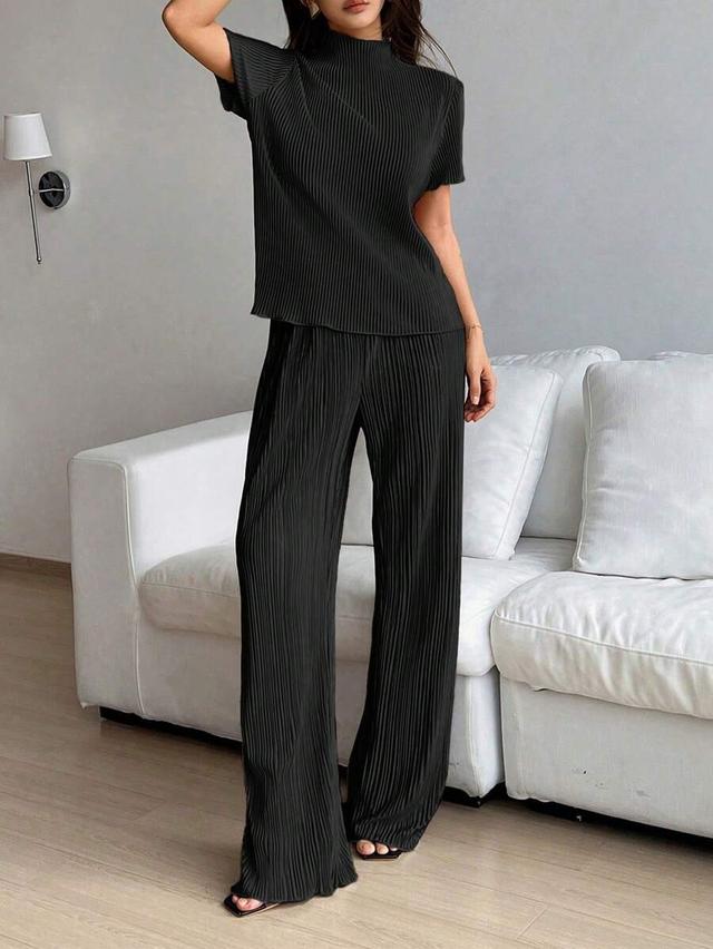 solid black pleated turtleneck top and trousers set