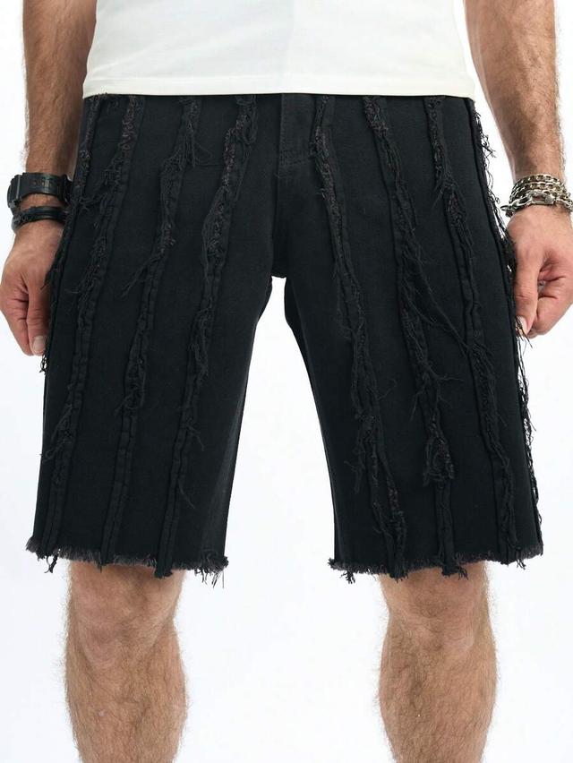 black denim straight-leg shorts with frayed vertical detailing