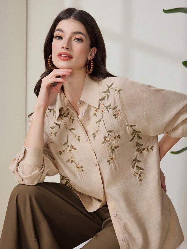 beige casual button-down shirt with plant embroidered dolman sleeves