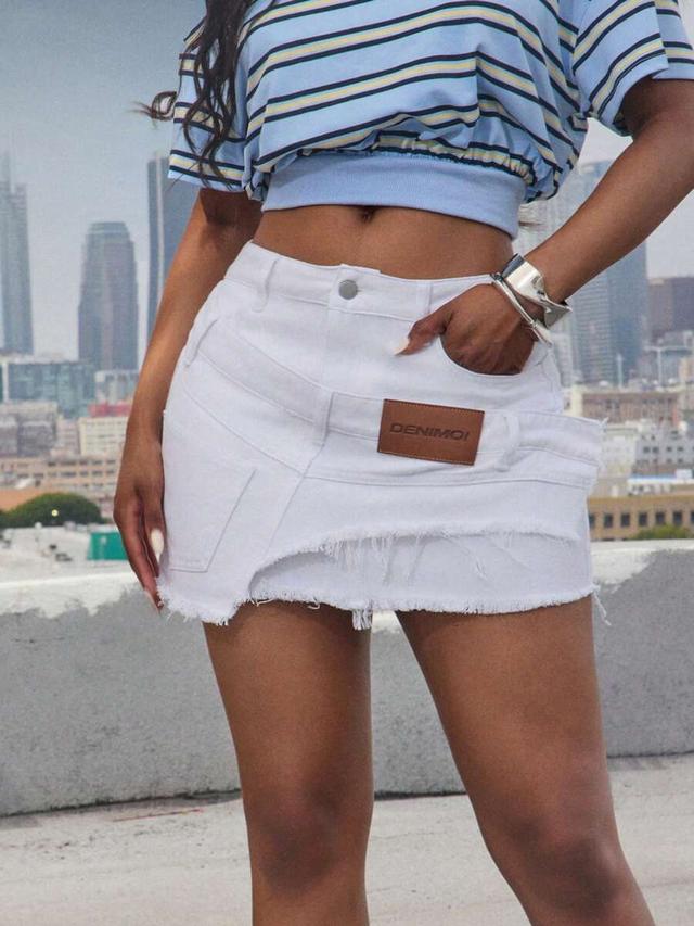 white denim mini skirt with frayed hem and patch