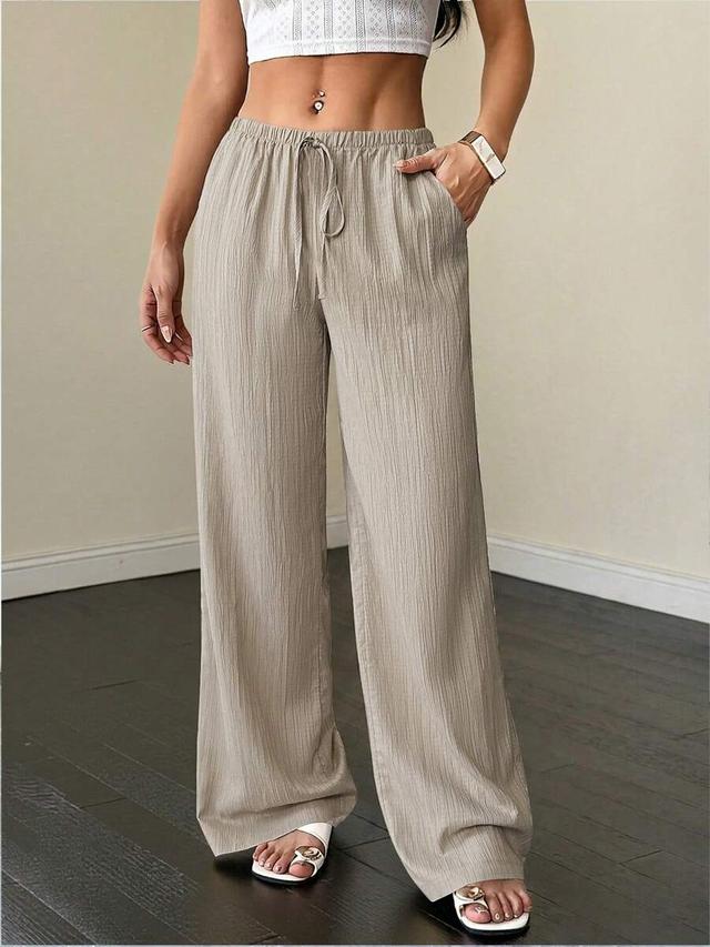 beige textured fabric waist tie wide leg pants