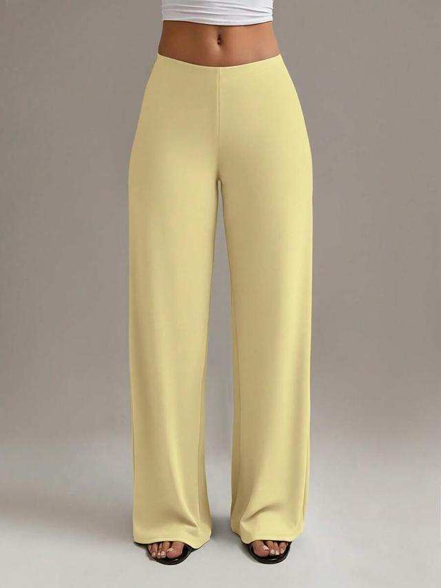 yellow high waisted straight leg trousers