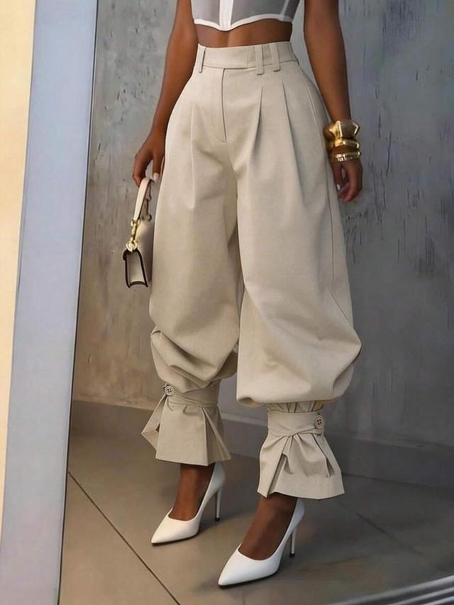 high-waist pleated balloon trousers with ruffle hem