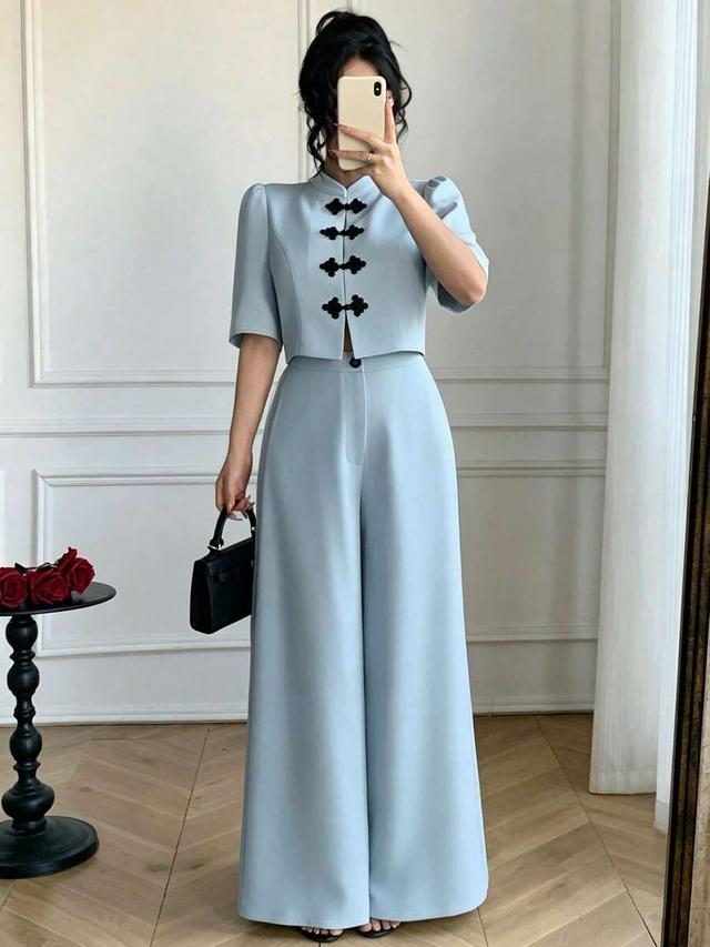 light blue puff sleeve blouse with wide leg trousers