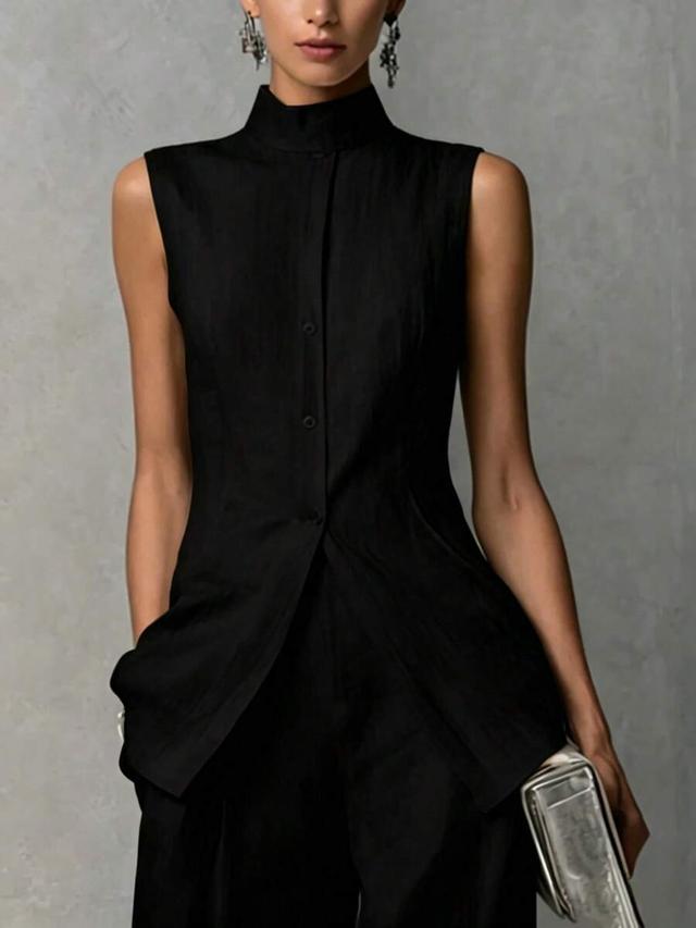 black sleeveless mandarin collar top and wide leg trousers