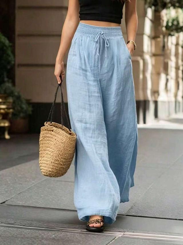 light blue high-waisted wide-leg linen trousers