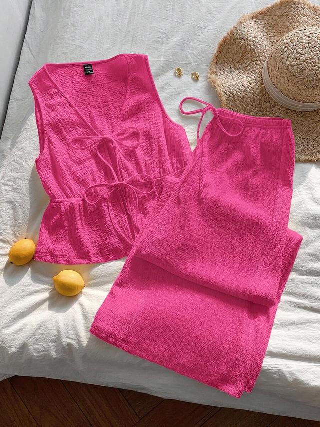 fuchsia textured front tie sleeveless peplum top
