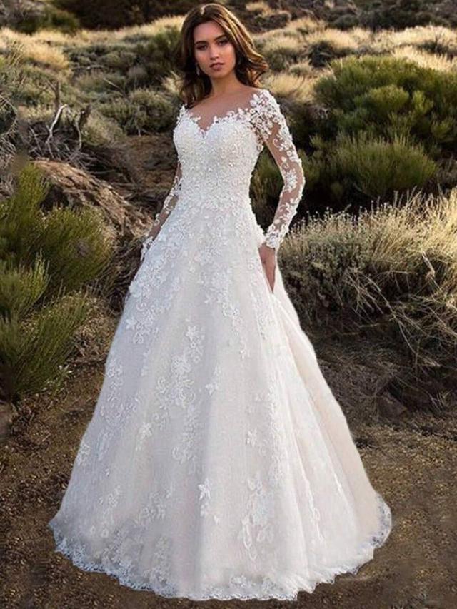 white long sleeve lace applique bridal gown