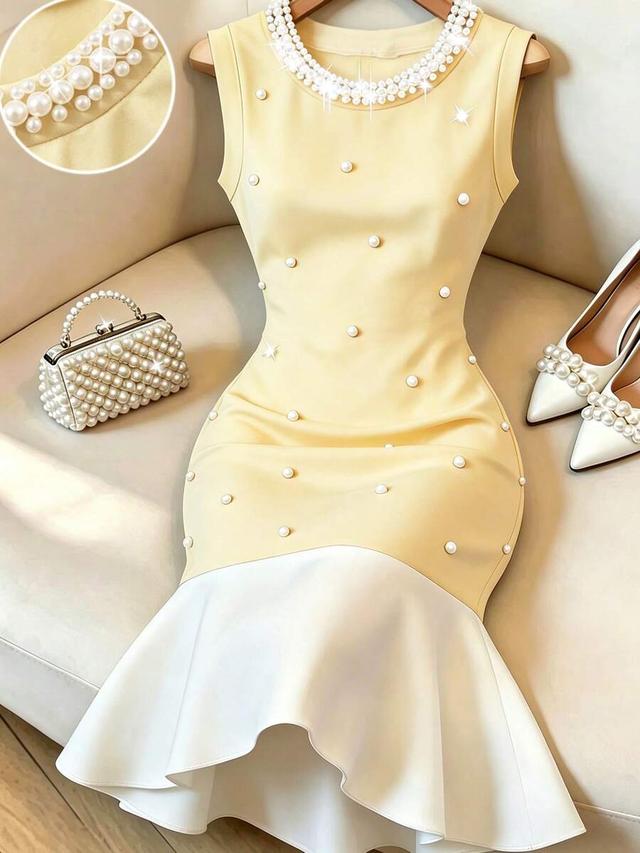 yellow sleeveless waist-cinching dress with pearl embellishment