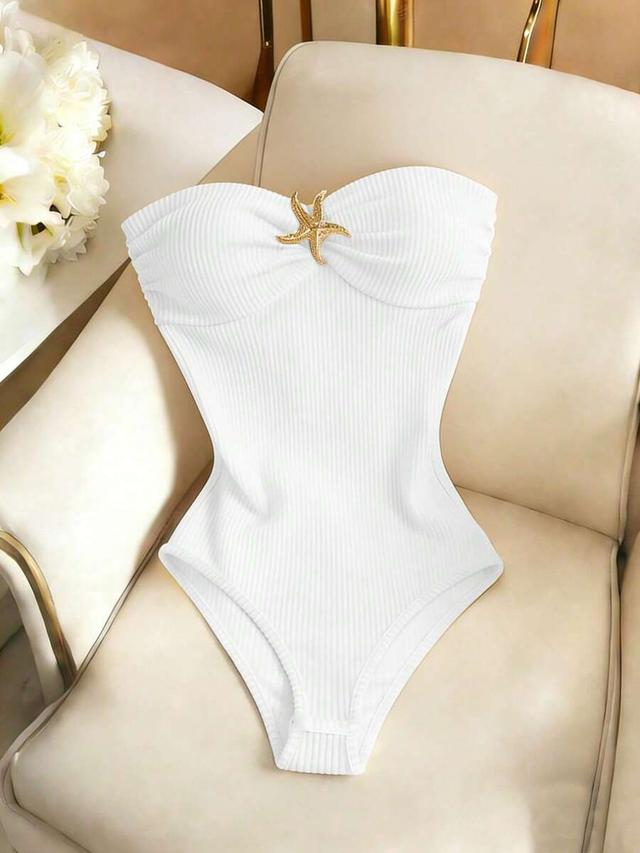 white ribbed strapless bodysuit with starfish buckle