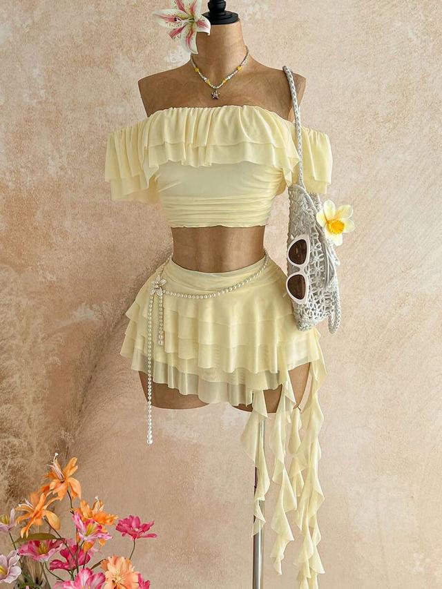 yellow ruffled off-shoulder top and asymmetrical ruffle skirt set