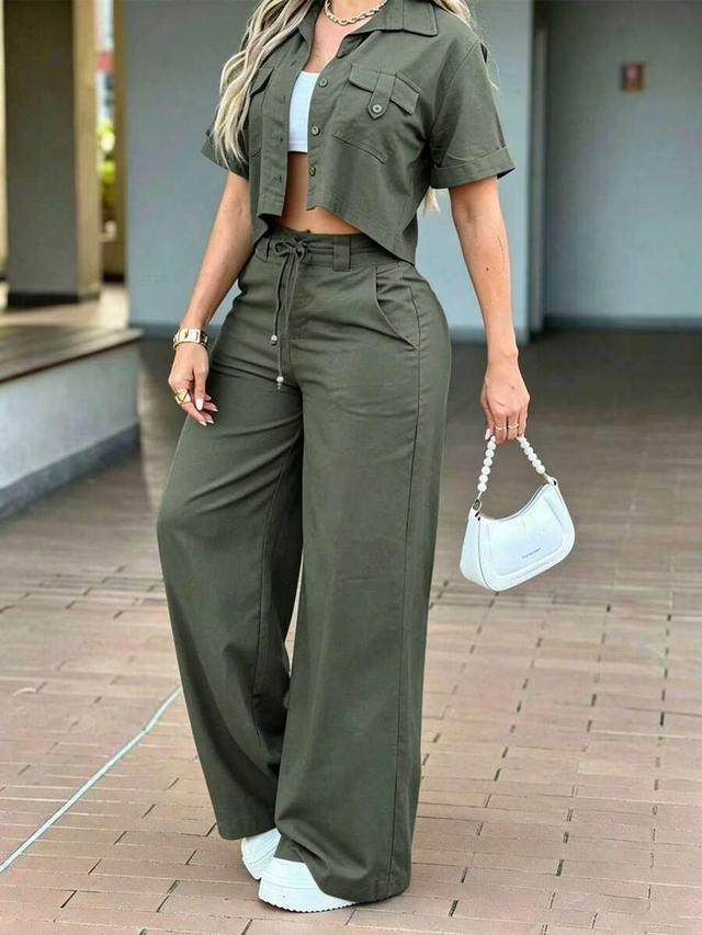 high-waisted olive green straight-leg trousers