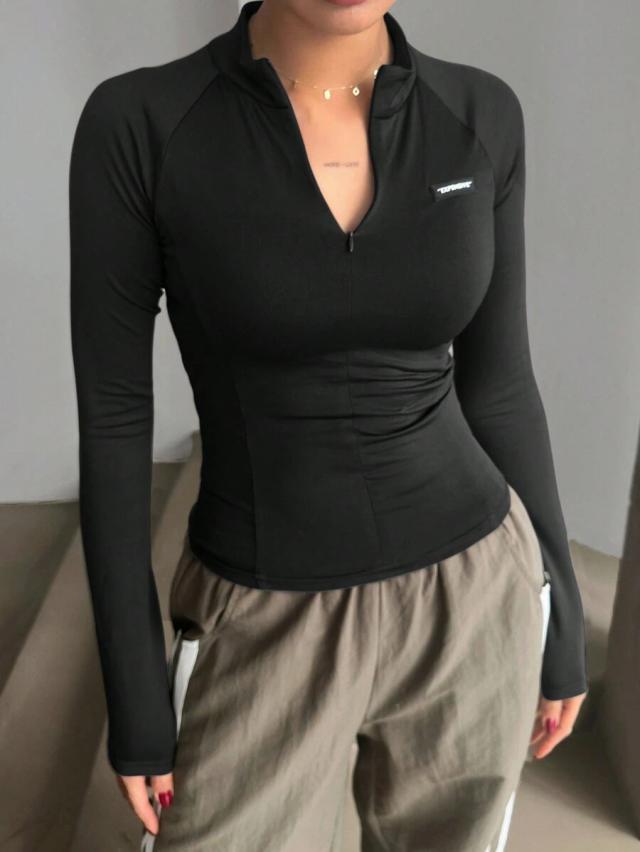 black half-zip mock neck long sleeve top