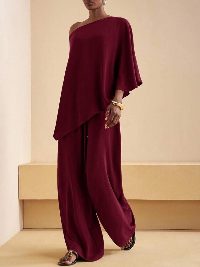 burgundy one-shoulder asymmetrical top and wide-leg trousers set