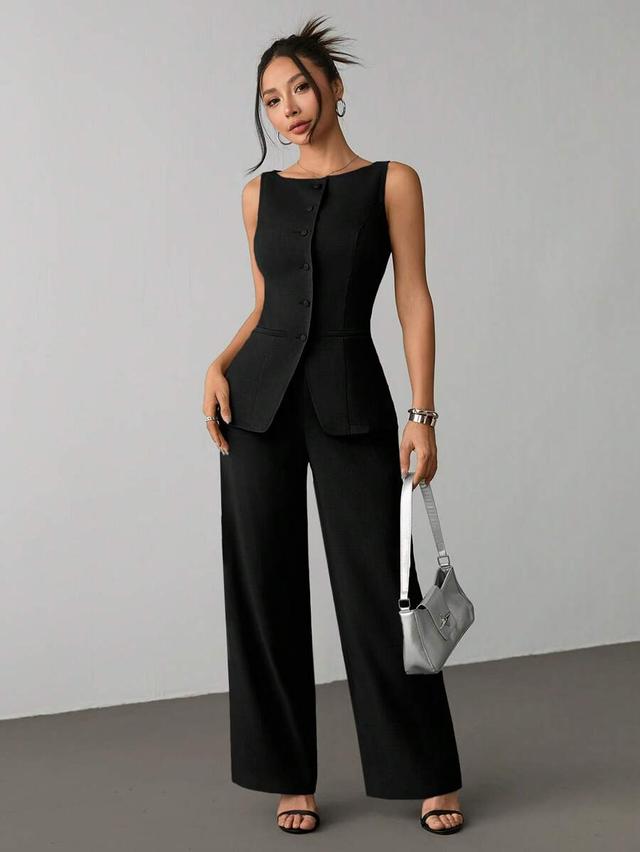 black sleeveless vest and matching wide-leg trousers set