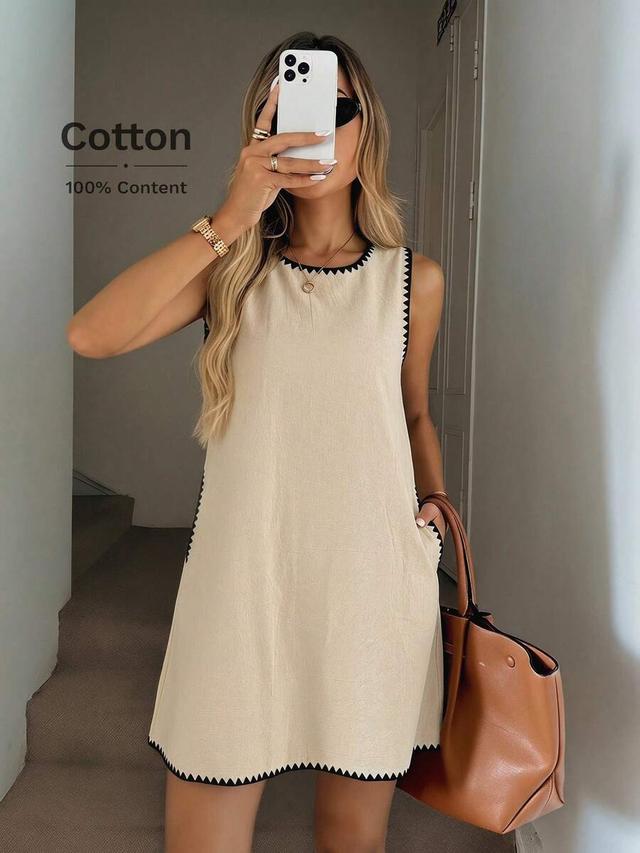 beige cotton sleeveless a-line dress with contrast trim