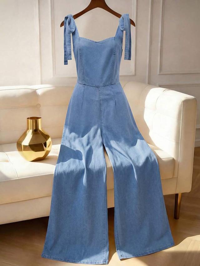 light blue denim wide-leg jumpsuit with tie straps