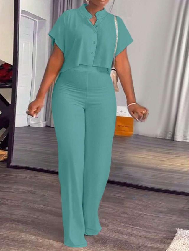 solid teal stand collar shirt and wide leg trousers