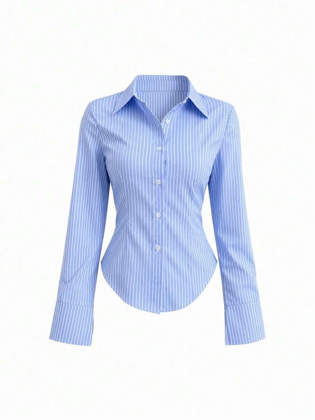 blue and white striped waist-cinching long sleeve shirt