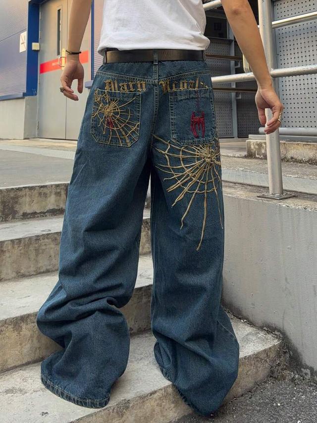 loose fit denim jeans with spider web embroidery