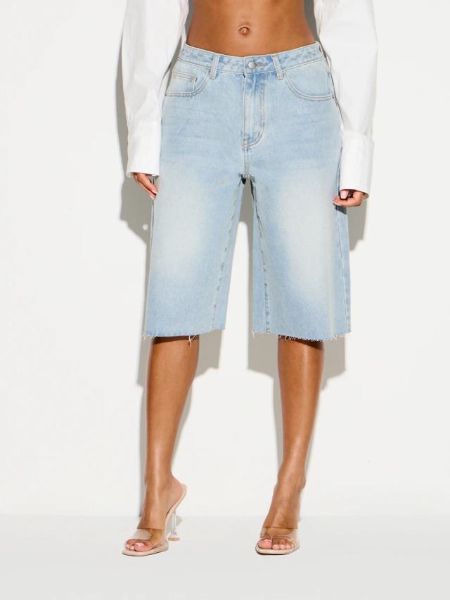 light wash denim bermuda shorts with raw hem