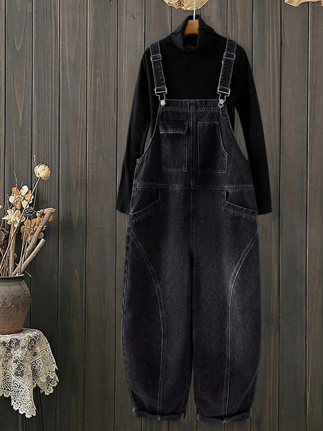 black denim dungarees with curved panel detailing