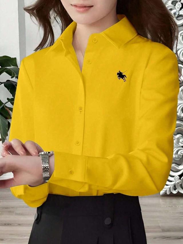 yellow long sleeve button-up shirt with knight embroidery