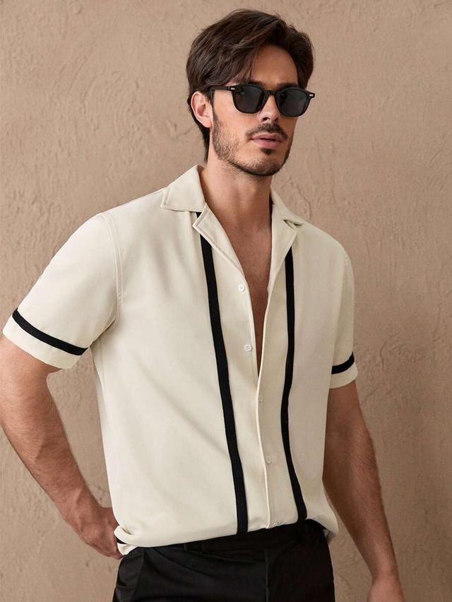 cream short sleeve button-up shirt with black trim