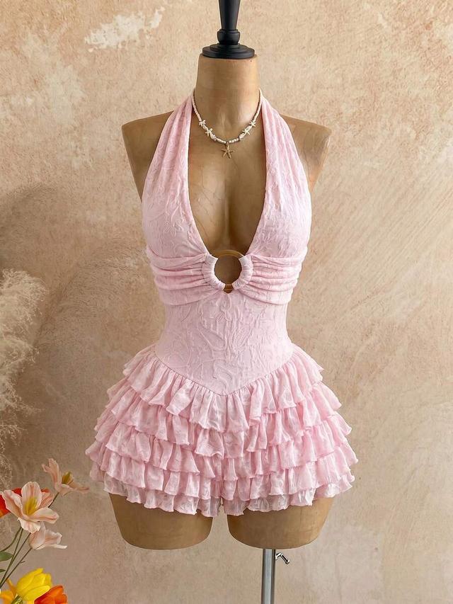 light pink textured halter playsuit with ruffled skirt