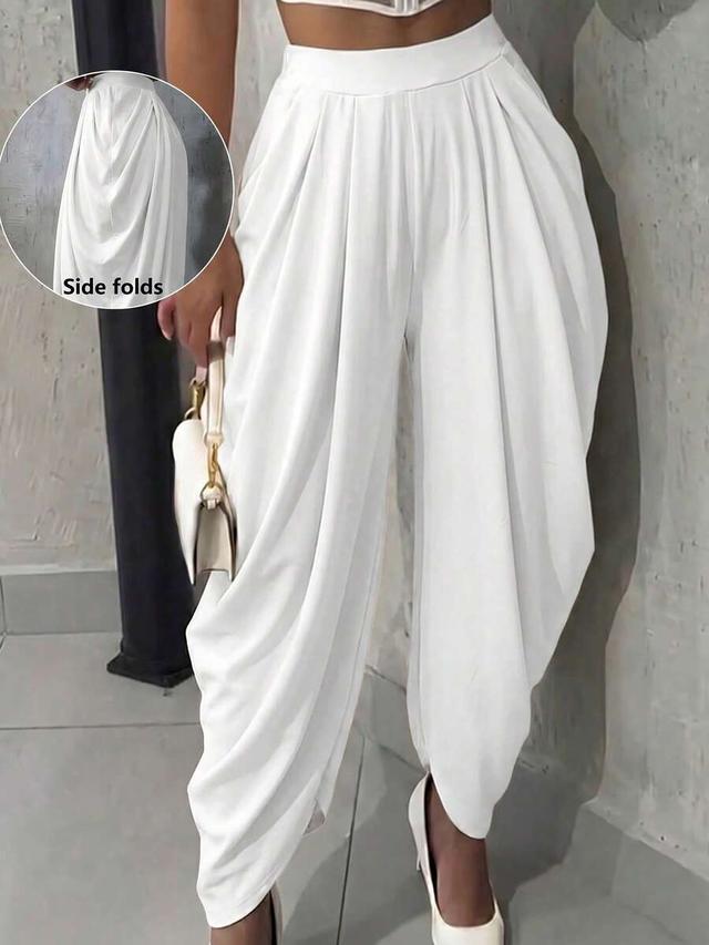 white pleated loose fit knit trousers