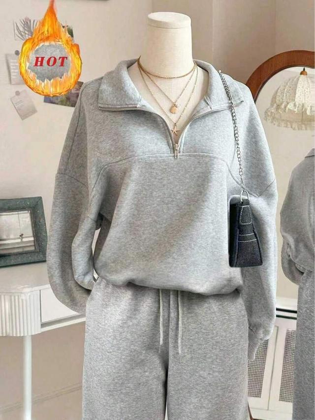 grey half-zip hoodie with matching straight leg pants