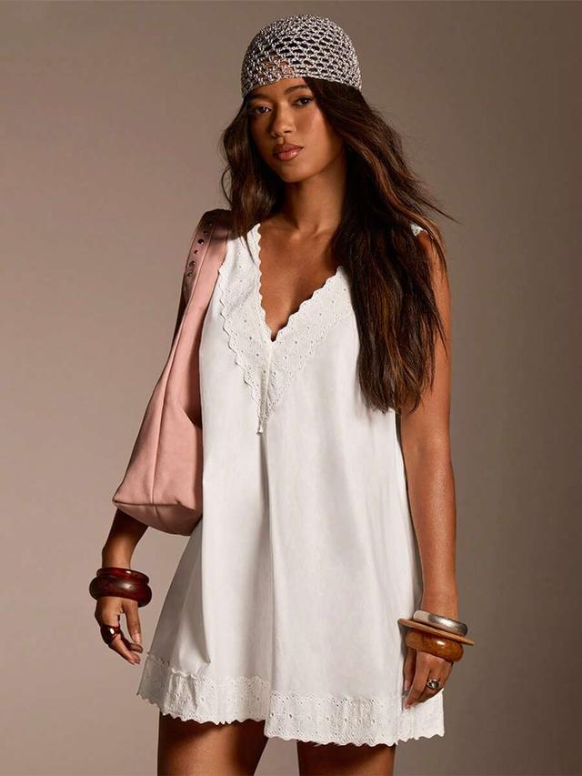 white cotton shift dress with eyelet lace trim