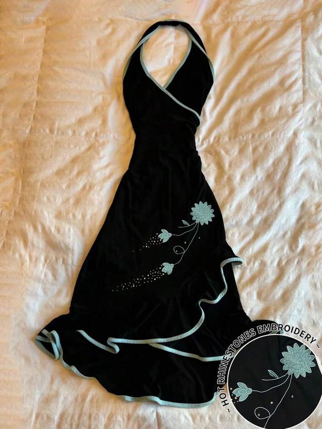 black halter dress with light blue trim and floral embroidery