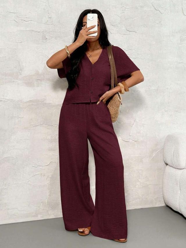 burgundy v-neck button-up shirt and wide-leg trousers set