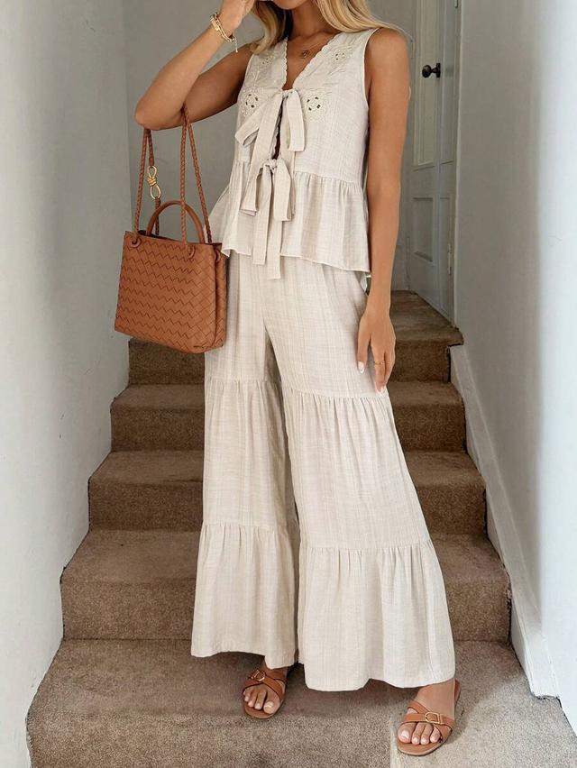 apricot sleeveless tie-front peplum top and tiered trousers