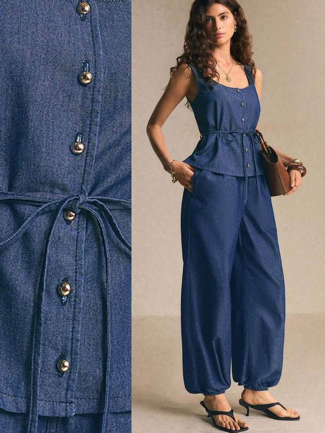 dark denim sleeveless peplum top with matching wide-leg trousers