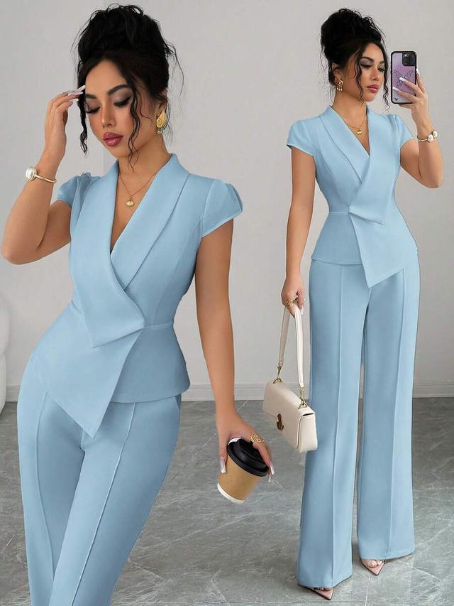 baby blue asymmetrical collar blouse and wide-leg trousers set