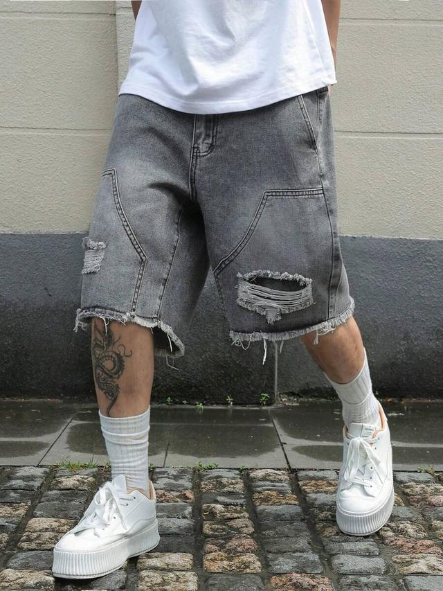 grey washed denim shorts with frayed edges and rips