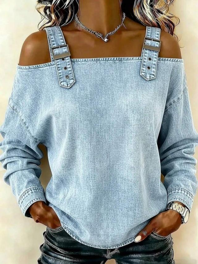 light wash denim long-sleeve top with strap detailing