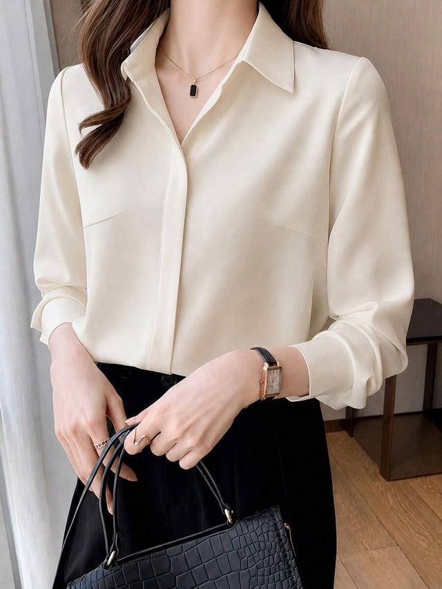elegant cream button-up blouse with hidden placket