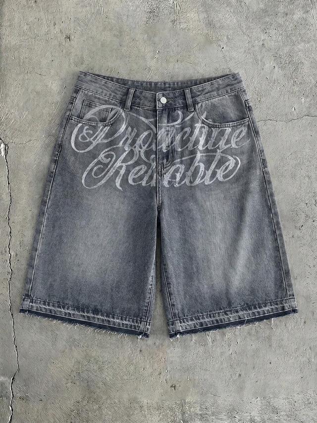 washed grey denim shorts with embroidered graphic design