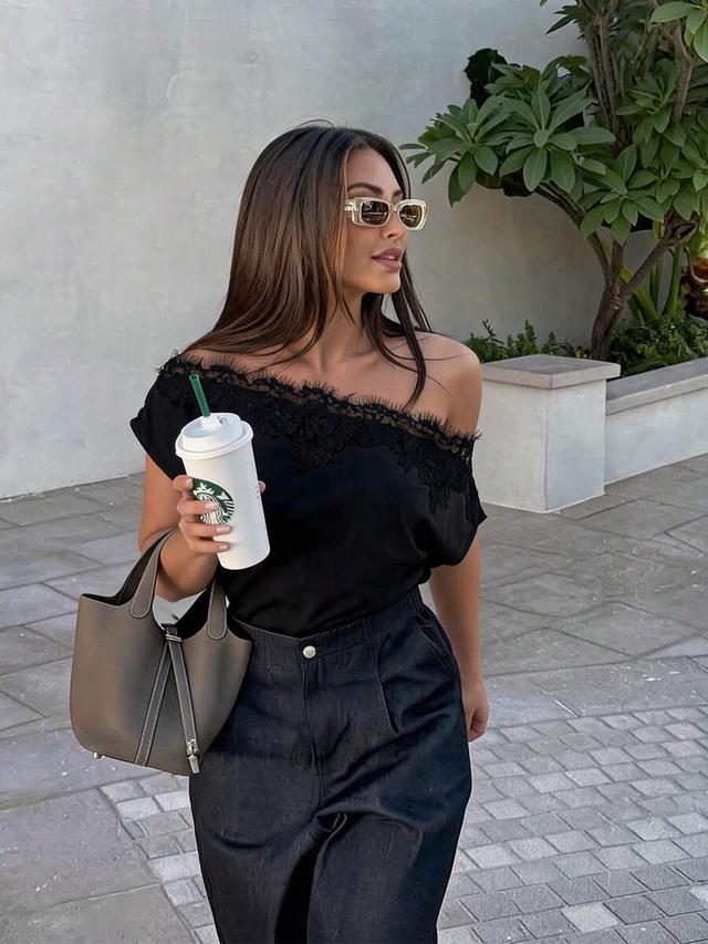black asymmetric ruched satin blouse with lace trim