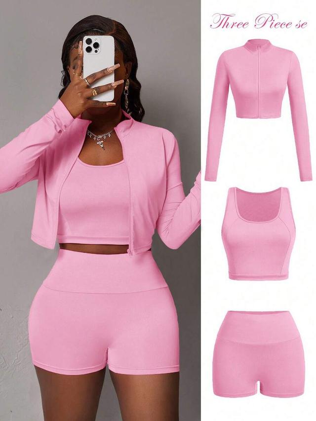 pink half-zip jacket with crop top and shorts