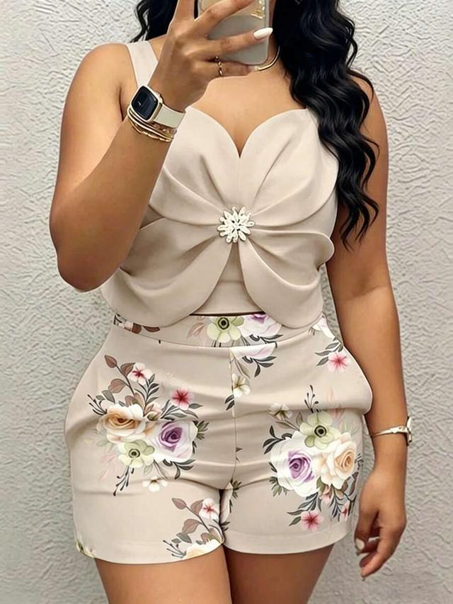 beige metal flower tank top and floral print shorts